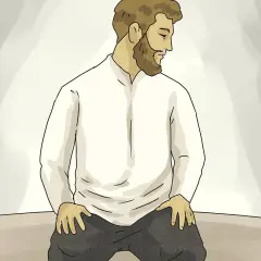 Man med skägg sitter på knä, redo för Asr-bönen.