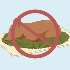 En hel, stekt gris på ett fat, med ett rött förbudstecken över. Detta symboliserar att fläskkött är haram.